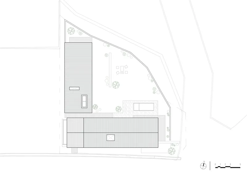 Roof plan drawing depicting the corrugated metal roof volumes and outdoor courtyard spaces