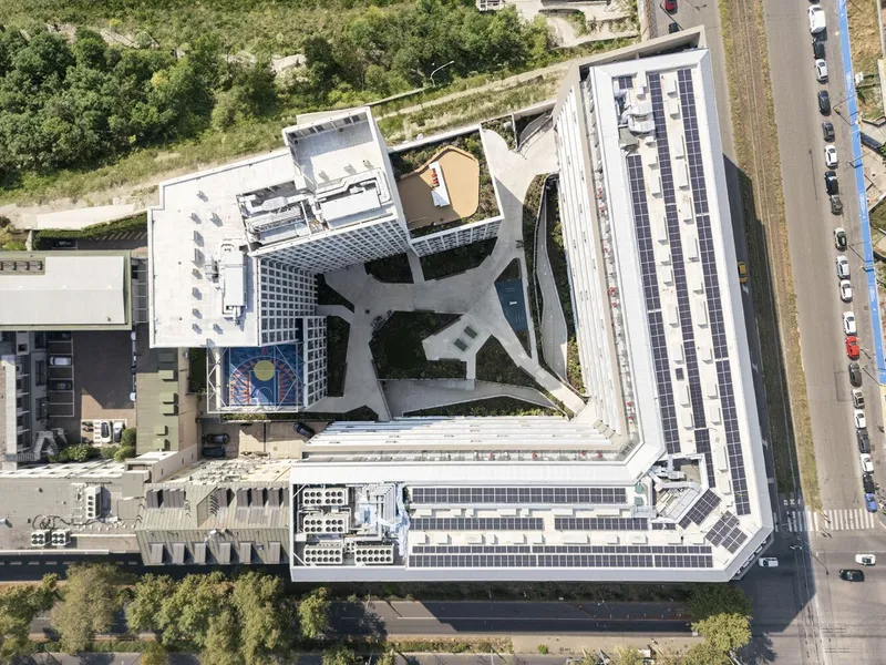 Aerial view of the solar panel array covering the rooftop terrace and central courtyard structure