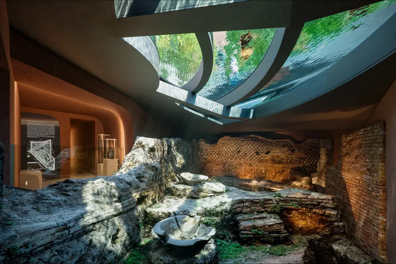 Courtyard with excavated stone foundations and brick walls under a glazed skylight with green plantings