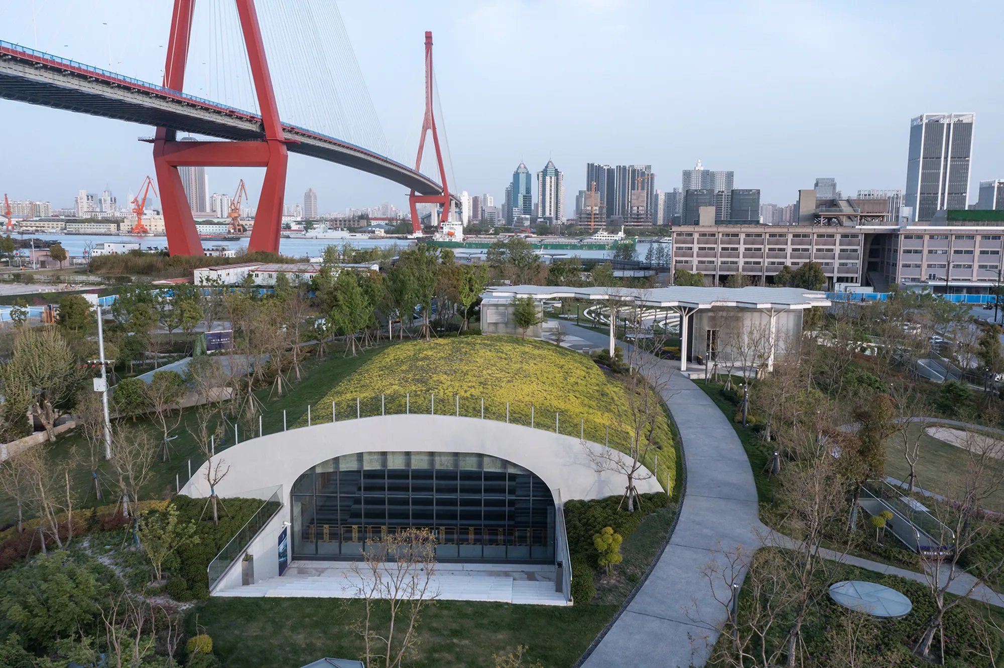 Atelier L+ Buries a Theater Under the Lawn to Reclaim Shanghai's Industrial Waterfront