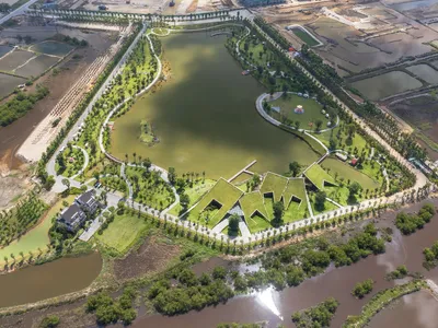 MIA Design Studio Disguises Five Pavilions as Grassy Hillsides on a Vietnamese River Peninsula