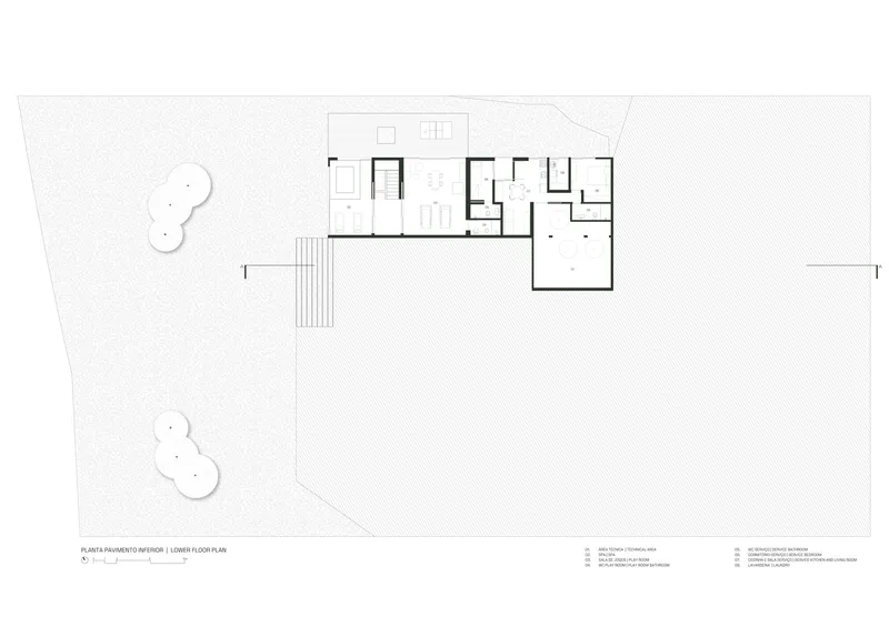 Upper floor plan drawing showing bedroom wing and corridor layout on sloped site