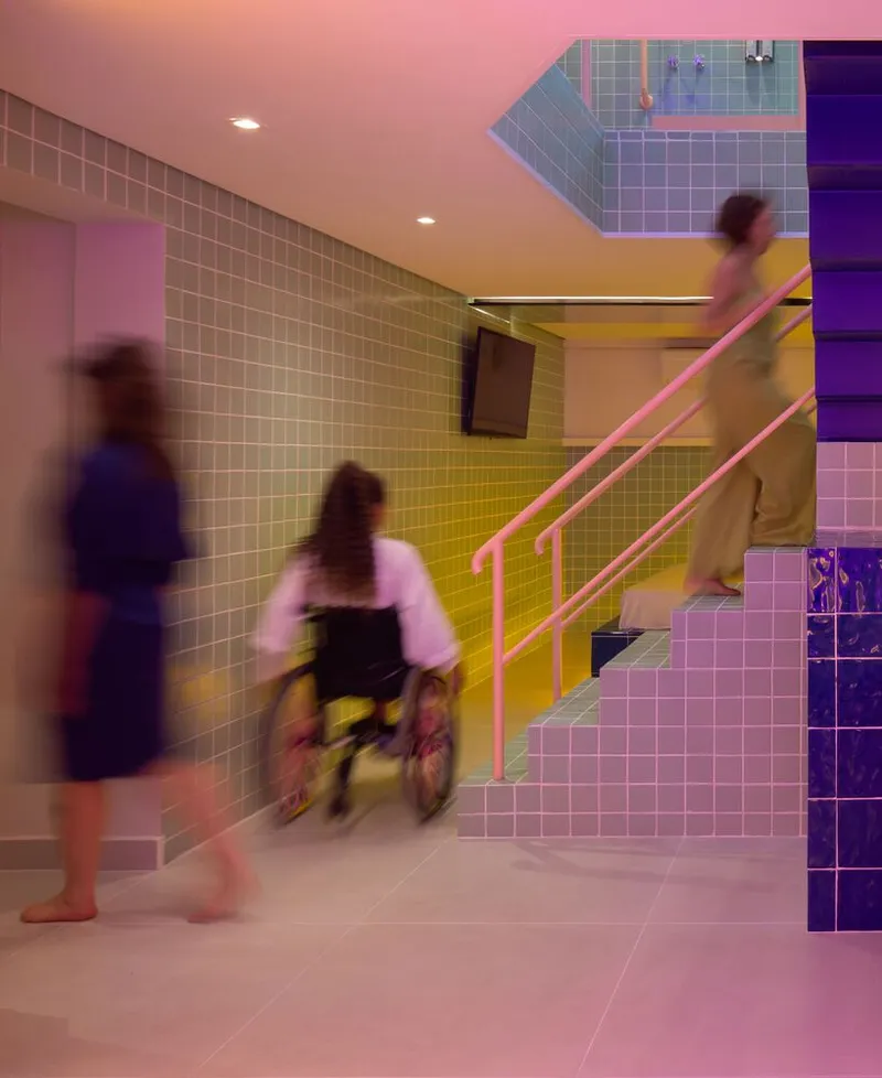 Tiled interior with pink staircase and three figures moving through gradient lit space