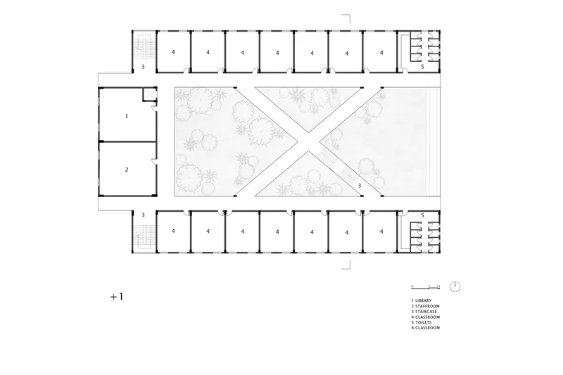 First floor plan drawing showing classroom wings and a central courtyard with an X-shaped circulation pattern