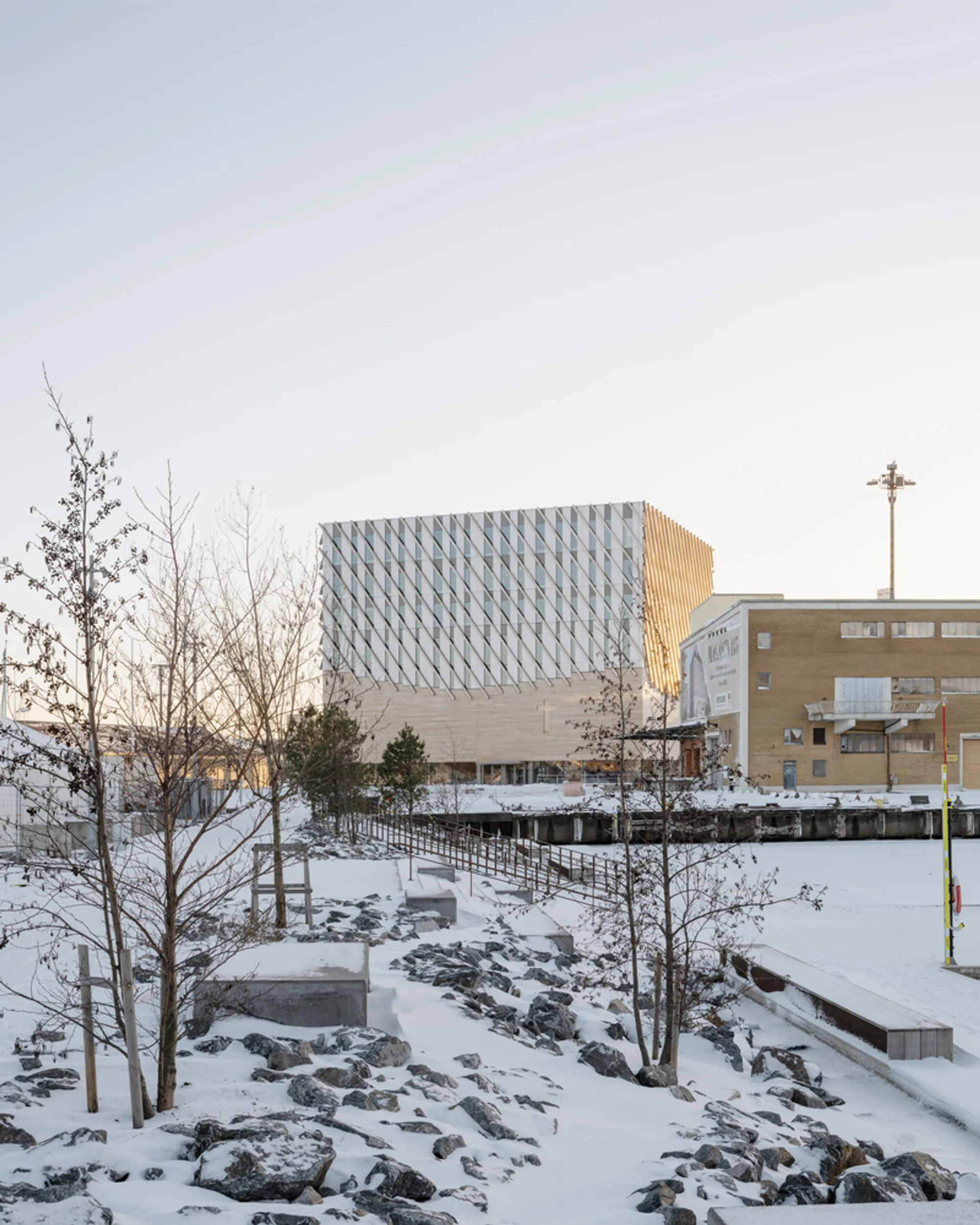 Elding Oscarson Stacks a Civic World atop a Column-Free Church Hall in Gothenburg's Docklands