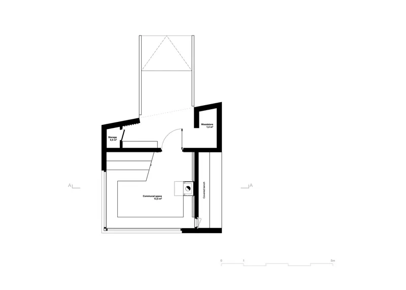 Floor plan drawing of a compact cabin with central living space and attached bath