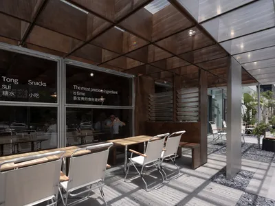 NEMEArchitects Turns a Foshan Dessert Shop into a Sundial That Tracks Time in Dappled Light