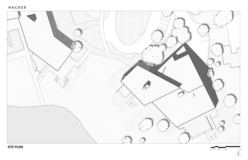 Site plan drawing showing two angled volumes among existing trees and topography