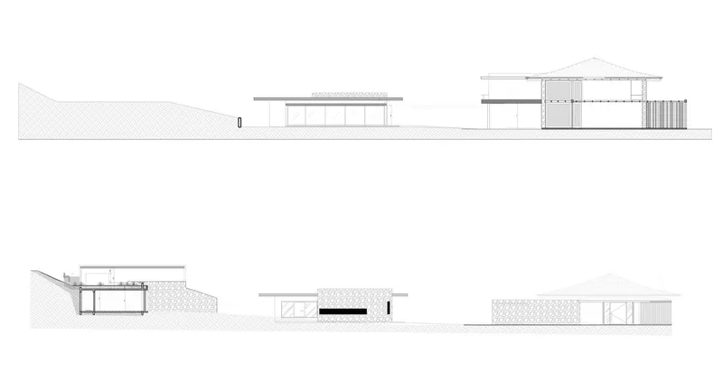 Elevation drawings showing two different sides of a residence on sloping terrain