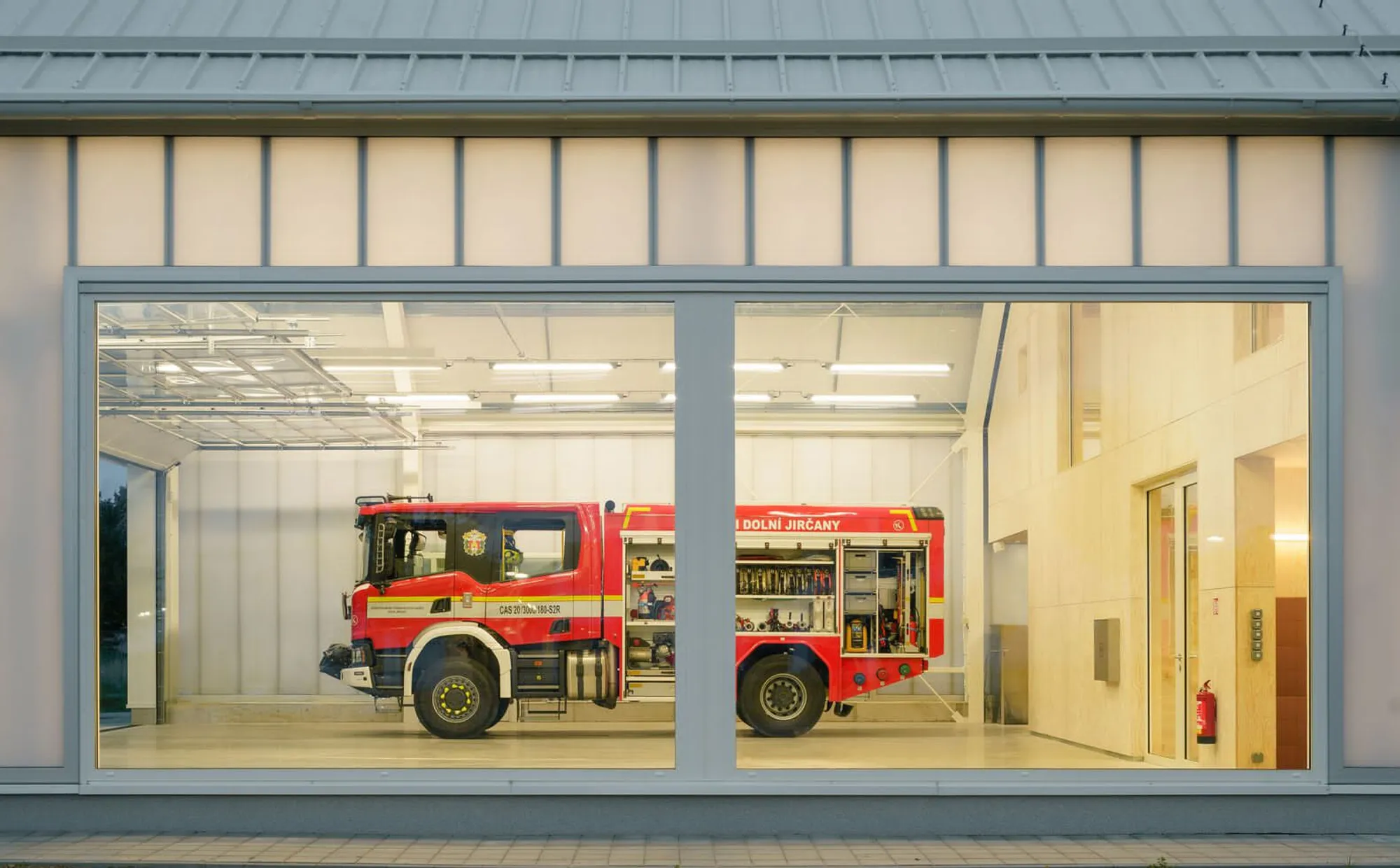 SOA Architekti Wraps a Czech Village Fire Station in a Glowing Polycarbonate Barn