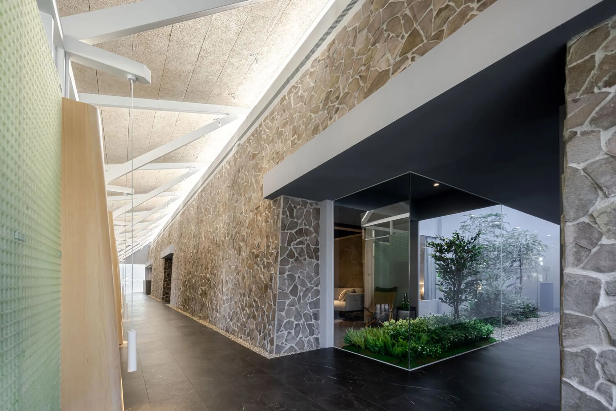 InOrder Studio Lines a Taichung Riverbank with Pigpen Grates and River Stones to Sell Apartments
