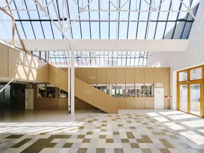 FREAKS Architecture Converts a Montreuil Taxi Garage into a Cooking School for Migrant Chefs