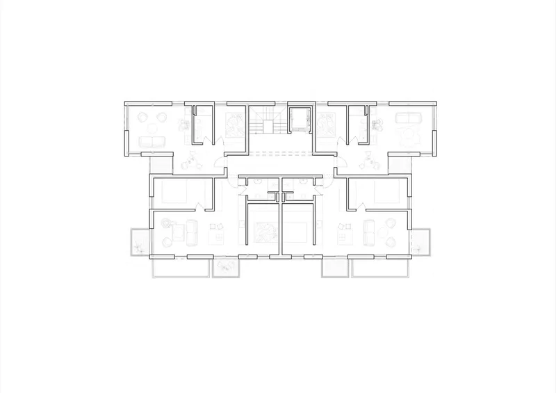 Floor plan drawing showing units with corner balconies extending from the main volume