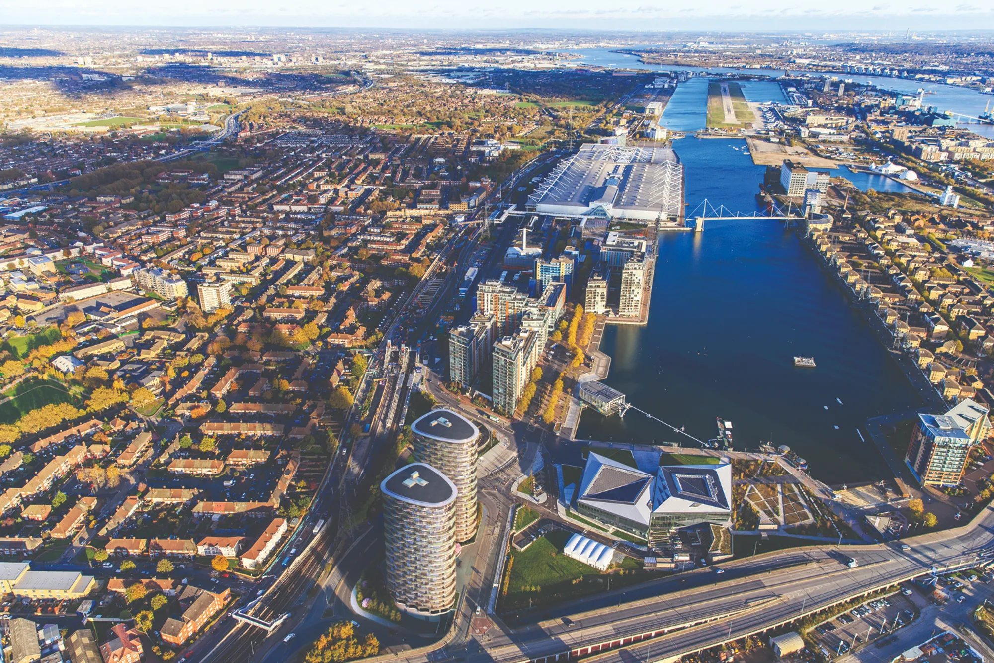 CZWG Architects Wraps Two Docklands Towers in Rippling Balconies That Borrow Heat from Next Door