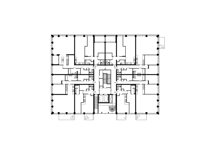 Floor plan drawing showing residential units arranged around a central circulation core