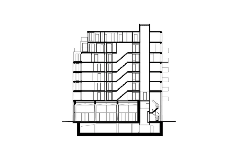 Section drawing revealing internal circulation with zigzag stairs and a vertical core on the right