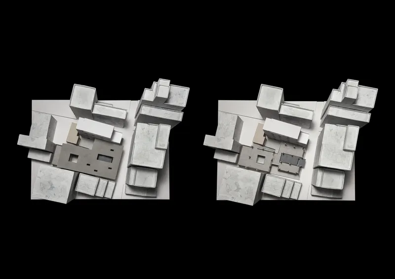 Axonometric model rendering showing clustered volumes and courtyards with material textures indicated in grayscale