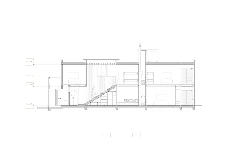 Section drawing revealing a central staircase connecting split-level rooms across two floors