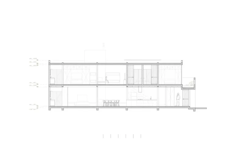 Section drawing showing a two-story dwelling with interior stairs and a series of vertical structural posts