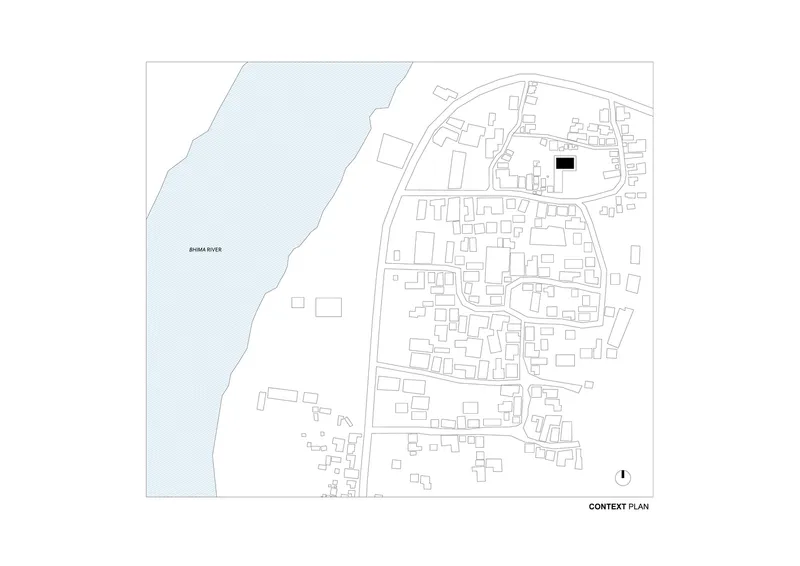 Context plan showing the building site marked in black within a dense settlement along a river
