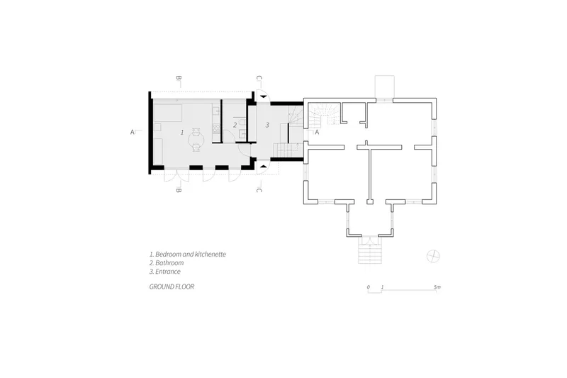 Ground floor plan drawing showing entrance, bathroom, and bedroom with kitchenette