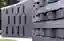 This architectural image showcases a modern brick wall with a unique pattern. The bricks are arrange