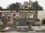 This architectural image showcases a cemetery with a mausoleum wall featuring multiple crypts. The f