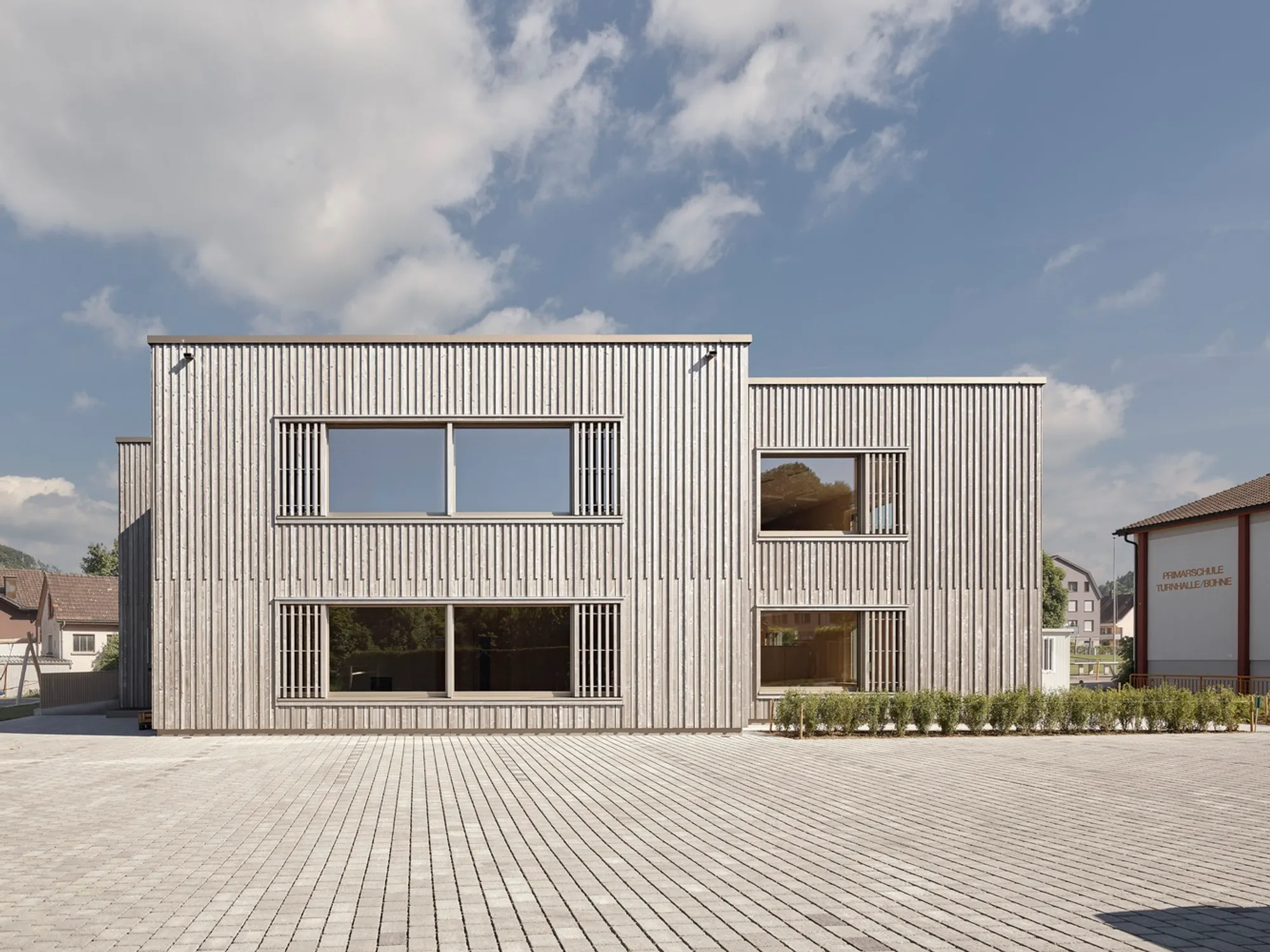 Eco-Friendly School Architecture: The Bütschwil Primary School by Illiz Architektur