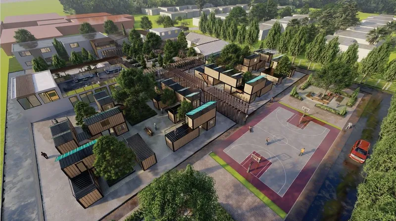 Modular container housing community with green spaces and amenities.