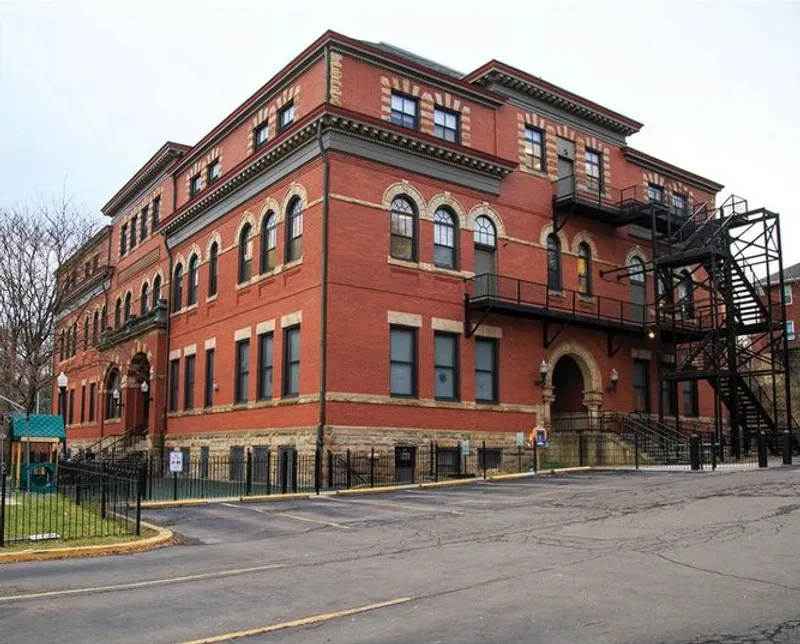 Historic red brick building with modern fire escape.