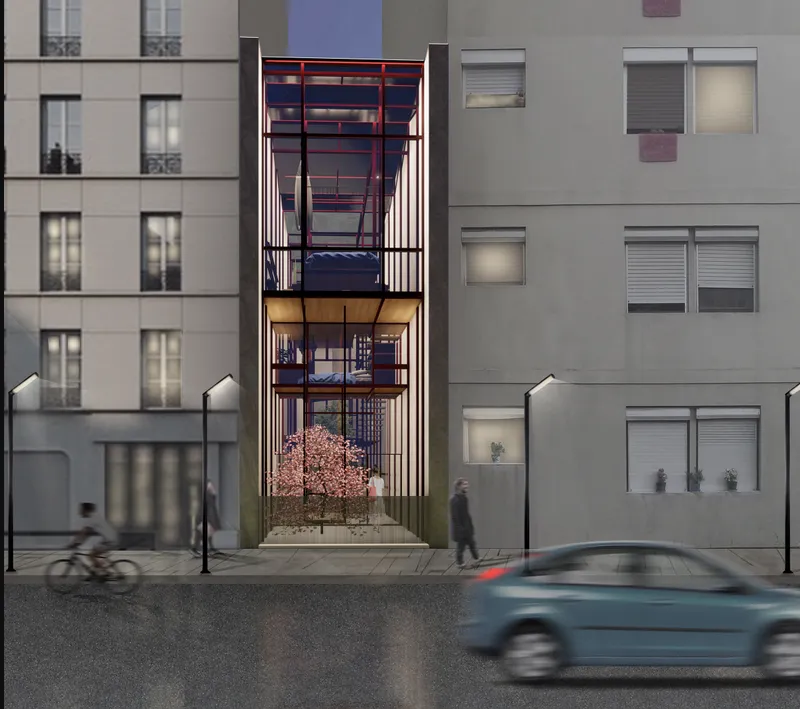 Narrow facade insertion between apartment blocks at dusk with cyclist and passing car