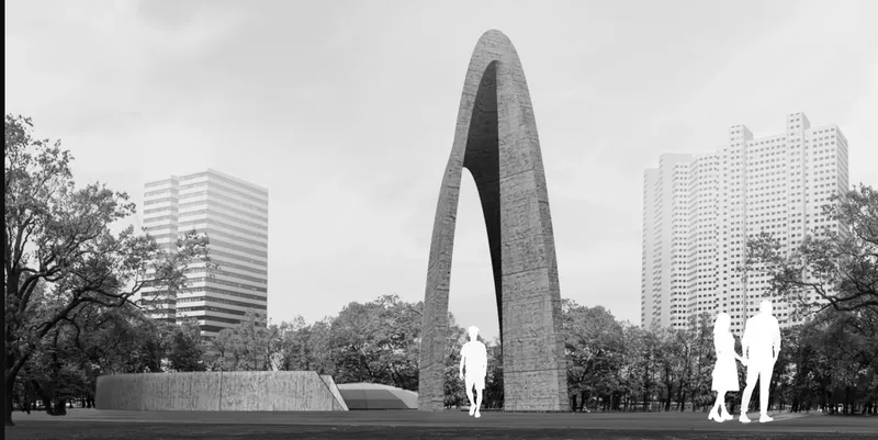 Tall concrete arch monument rising from a grassy park with surrounding trees and urban towers in the background