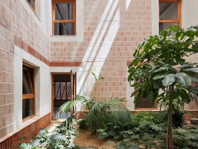 08014 Arquitectura Builds 24 Homes in Ibiza Using Seaweed Insulation and Earth-Filled Walls