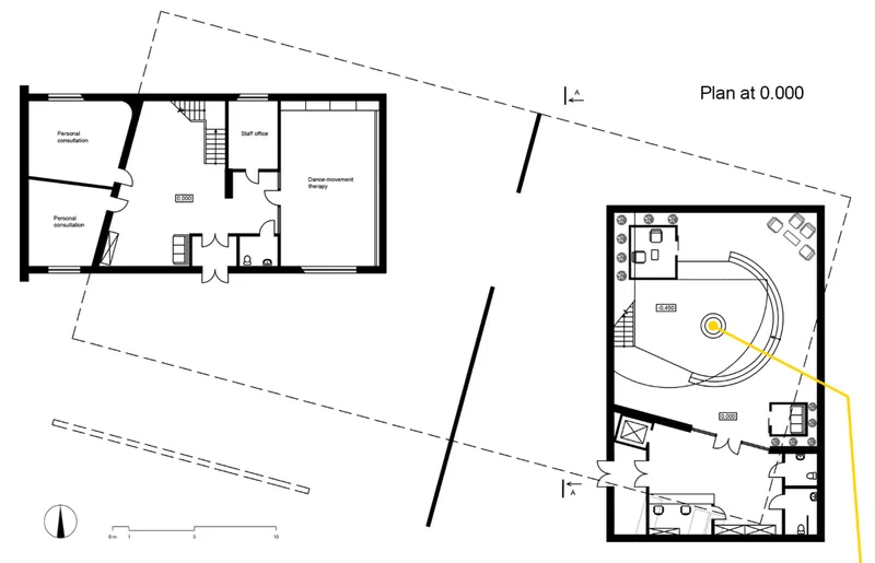 Floor plan drawing showing two connected volumes with a curved seating space and office areas