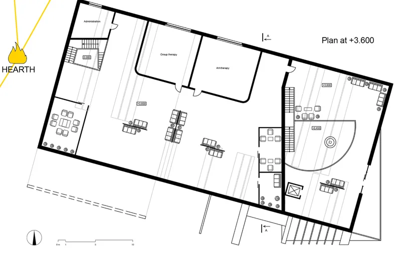 Upper level floor plan showing group therapy rooms, administration spaces, and a curved seating zone
