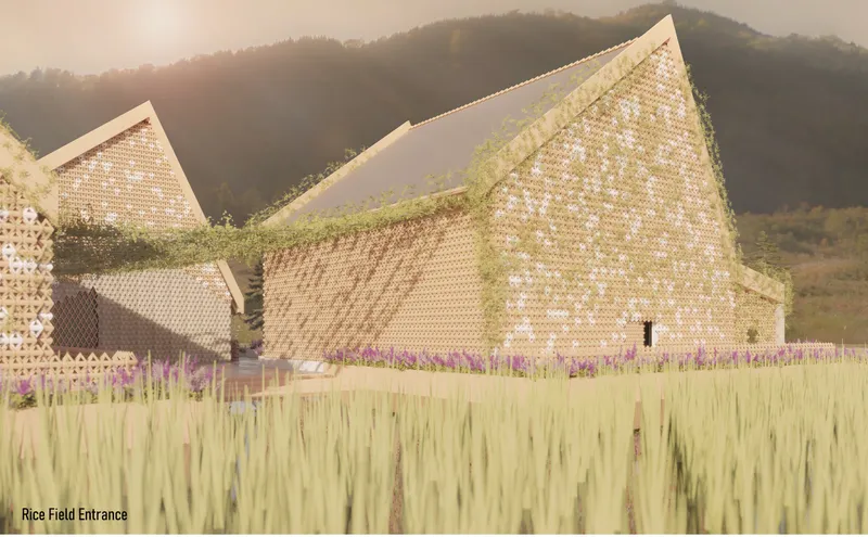 View of the perforated gabled facades rising from a rice field with mountains in the background