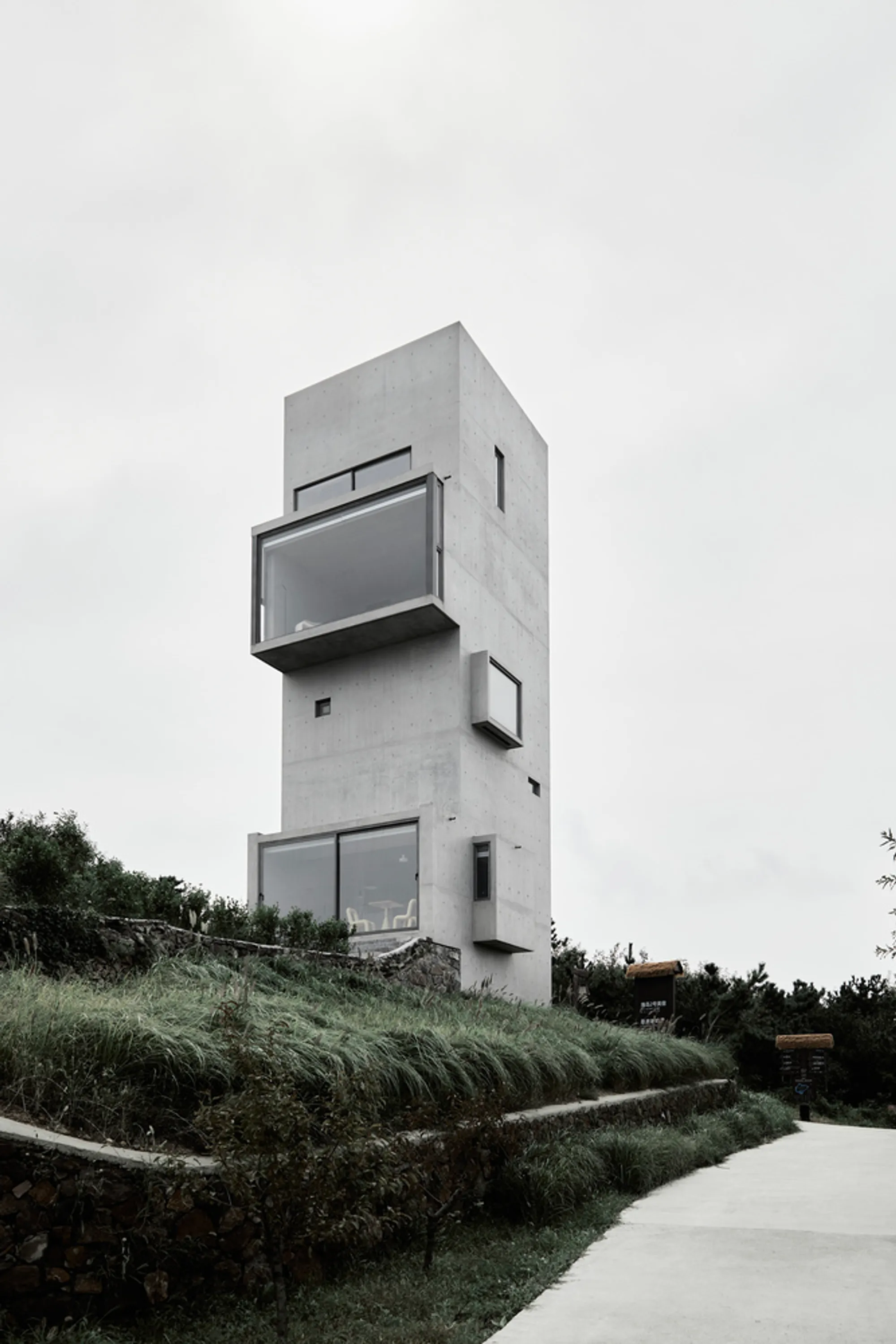 Cliff Café and Tower House by TAO: A Monolithic Retreat at the Edge of the Sea