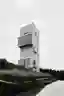 Cliff Café and Tower House by TAO: A Monolithic Retreat at the Edge of the Sea