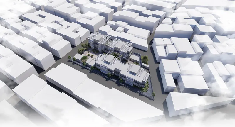 Aerial view of the multi-unit housing development within the surrounding urban block context