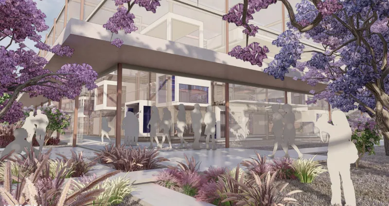 Ground level entrance canopy with columns framing a glazed lobby amid blooming jacaranda trees