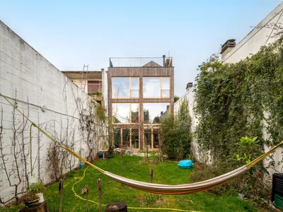Wood-Concrete House Design: A Contemporary Transformation by MANO