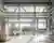 This architectural image showcases the interior of an industrial building with a focus on its functi