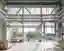 This architectural image showcases the interior of an industrial building with a focus on its functi