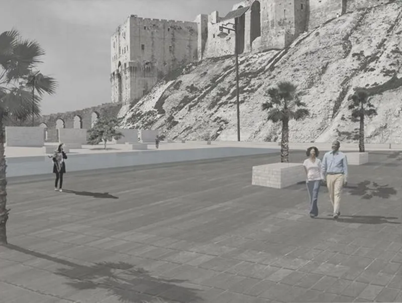 Paved public plaza with low block benches and figures walking in afternoon light