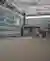 This architectural photograph showcases the interior of an industrial building, emphasizing its stru