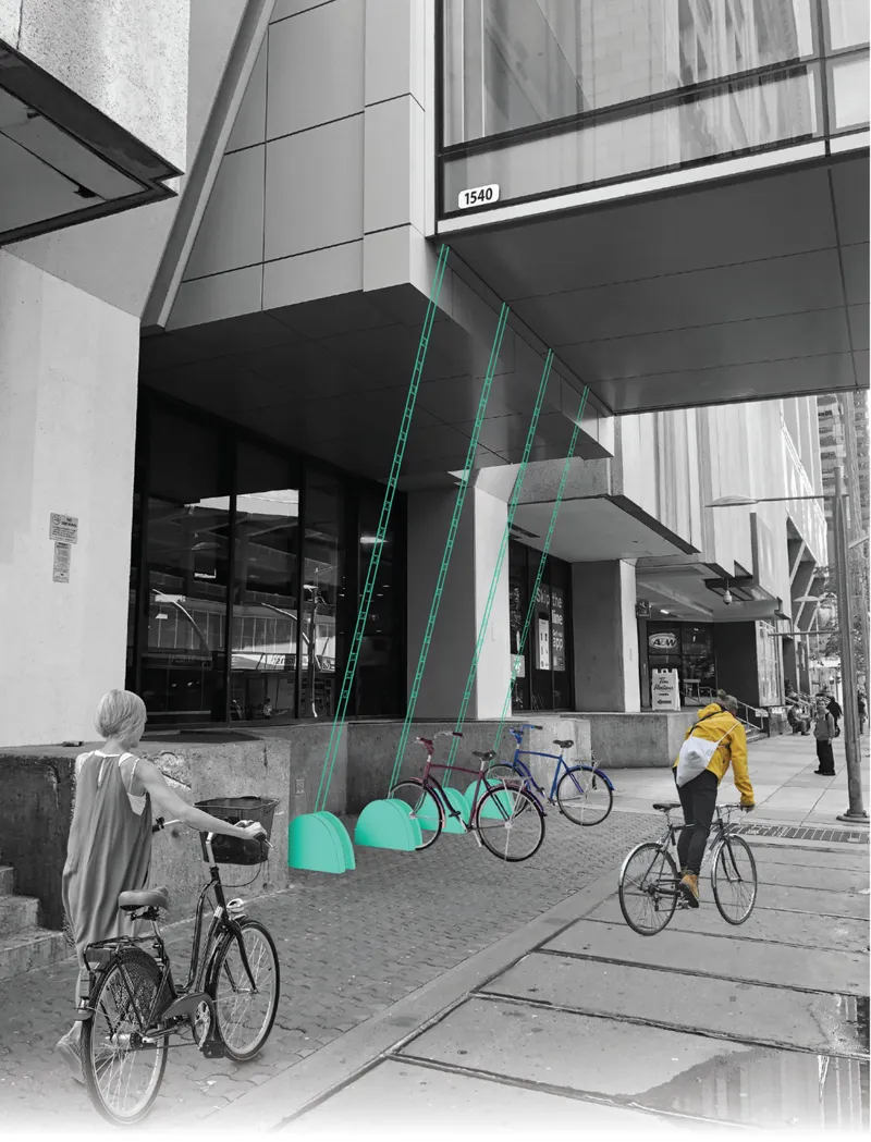 Ground-level entrance canopy with angled supports and cyclists passing on the sidewalk below