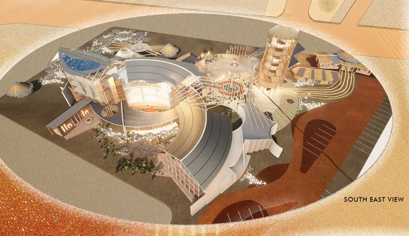 Aerial rendering showing the oval-shaped complex with curved roofs, timber towers and landscaped courtyards in desert surroundings