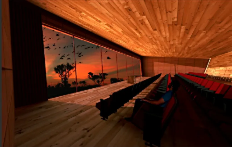 Auditorium with timber ceiling and seating rows facing a projection screen showing sunset silhouettes of birds and trees