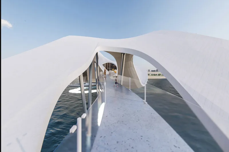 Pedestrian bridge with white railings arching over dark water under a bright sky