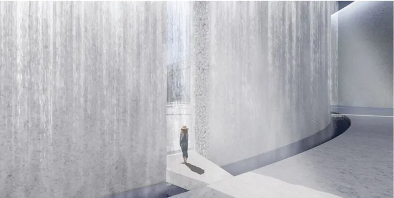 Close-up of vertical water feature cascading along white textured walls with a visitor below in sunlight